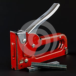 Used Staple Gun and Staples on Black