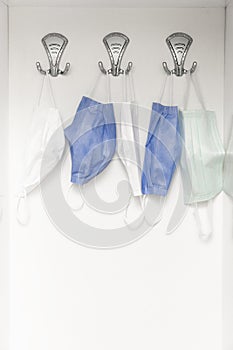 Used surgical face masks on the cloakroom at home