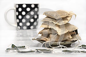 Used tea bags and a cup photo