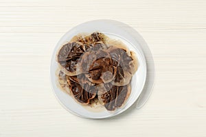 Used tea bags on white wooden table, top view