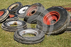 Used tractor tires and rims for sale at a farm show