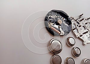 Used watch machine components on a white background