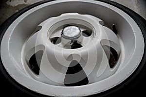 Used white titanium rims and tires with excellent tread await spring