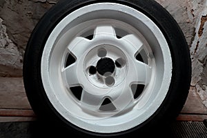 Used white titanium rims and tires with excellent tread await spring