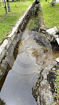Usefull drainage where rainwater is channeled photo