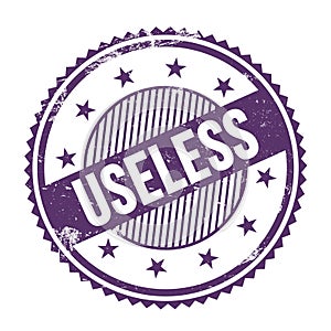 USELESS text written on purple indigo grungy round stamp