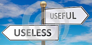 Useless and useful as different choices in life - pictured as words Useless, useful on road signs pointing at opposite ways to