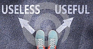 Useless and useful as different choices in life - pictured as words Useless, useful on a road to symbolize making decision and