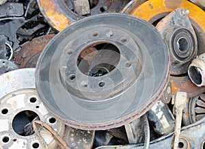 Useless  worn out old rusty brake discs and other spare parts