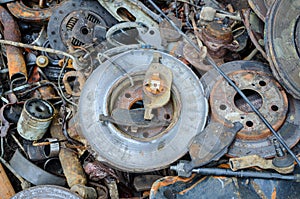 Useless, worn out rusty brake discs and other parts