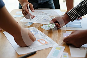 User experience UX designer designing web on smart phone layout. UI developer planning working on mobile application prototype