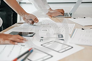 User experience UX designer designing web on smart phone layout. UI developer planning working on mobile application prototype