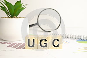 User generated content, UGC acronym on wood cubes