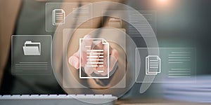 A user interacting with digital documents and file icons through a virtual interface, online document processing, cloud