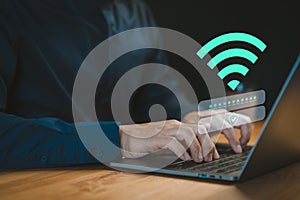 User logs into a laptop computer using a Wi-Fi connection, entering a username and password.