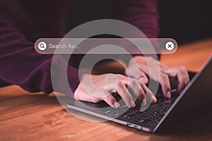 User use a computer laptop for internet search bar. SEO technology networking engine optimization internet with search bar.