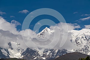 Ushguli - An amazing view on Shkhara Glacier in Ushguli, Georgia. Peaks covered by clouds