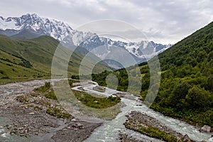 Ushguli- Patara Enguri River flowing down the valley in the Greater Caucasus Mountain Range in Georgia.