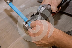 Using a cutter for plastic pipes repairing domestic water pipes hand plumbing