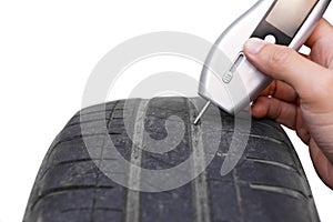 Using a digital tire tread depth measuring tool with old tire