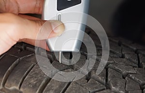 Using a digital tire tread depth measuring tool with old tire