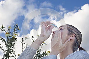 Using eyedropper to treat irritated eyes