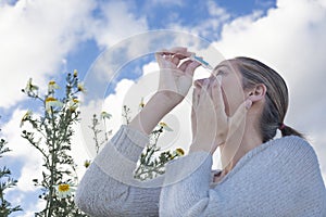 Using eyedropper to treat irritated eyes