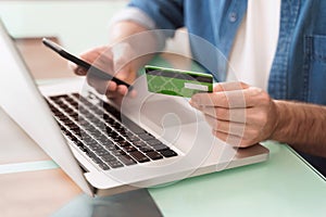 Using gadgets and bank card for e-shopping and online banking