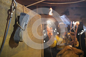 Using Gas detector while rope access welder commencing welding in confined space photo