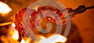 Using on an iron stick is roasting chicken in the oven