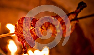 Using on an iron stick is roasting chicken in the oven