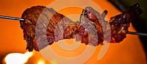 Using on an iron stick is roasting chicken in the oven