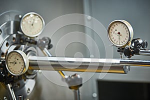 using measuring indicator head sensor for adjustment. centering and aligning of lathe machine equipment.