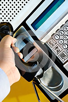 Using a public telephone