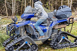 Using quad bike to transport tree trunks