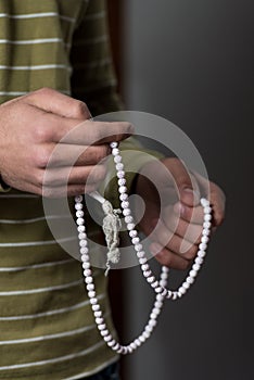 Using Rosary Beads In Hands