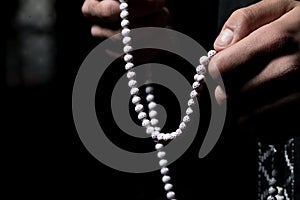 Using Rosary Beads In Hands