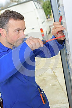 Using screwdriver on fusebox