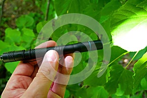 Using a small flashlight. Details and a close-up of a small lantern.