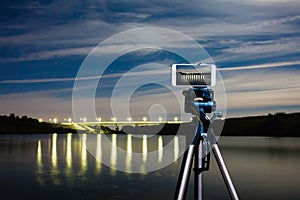 Using smartphone like professional camera on tripod to capturing night landscape