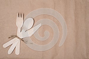 Using sustainable cutlery concept. Top above overhead view photo of a set of wooden cutlery placed to the left side isolated on