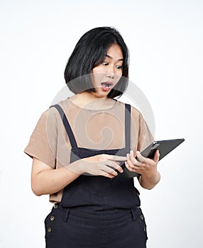 Using Tablet with wow face expression of Beautiful Asian Woman Isolated On White Background