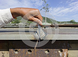 Using a taper gauge to measure the gap for joint preparation before welding add joint of steel plate photo