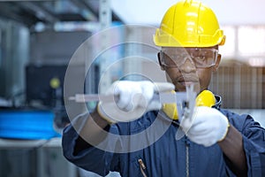 Using Vernier caliper to measure the dimensions thickness of the Pipe Fittings. safety and health accessories for employees and