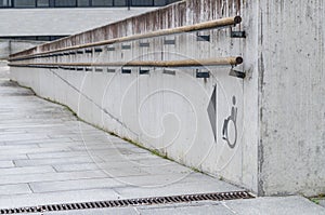 Using wheelchair ramp with physical impairment symbol