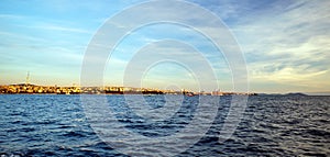 Uskudar, Kadikoy shorescape and marmara sea under blue summer sky photo