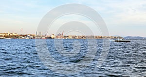 Uskudar, Kadikoy shorescape and marmara sea under blue summer sky photo