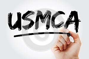 USMCA - United States Mexico Canada Agreement acronym with marker, concept background