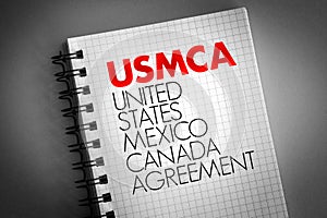 USMCA - United States Mexico Canada Agreement acronym on notepad, concept background