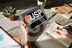 USP - Unique selling propositions. Business and finance concept on device screen. photo